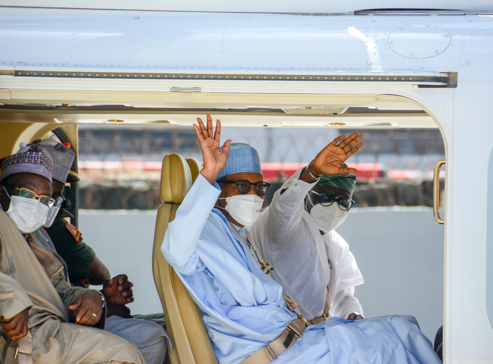 Nigerian President Muhammadu Buhari and Lagos Governor Babajide Sanwo-Olu wave from the presidential helicopter, Lagos, Nigeria